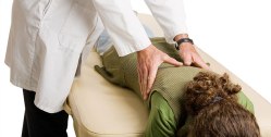 Chiropractic patient receiving a lumbar spine adjustment.